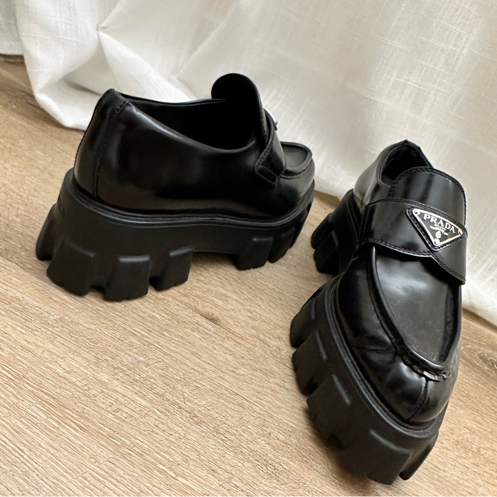 Black PRADA monolith leather loafers.